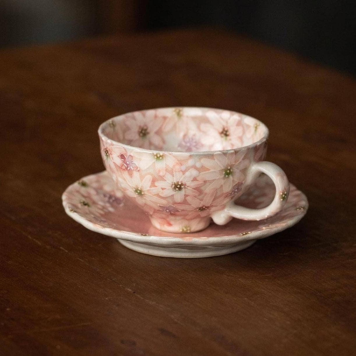 Japanese dance pottery tea cup and saucer with colorful hand-painted flowers