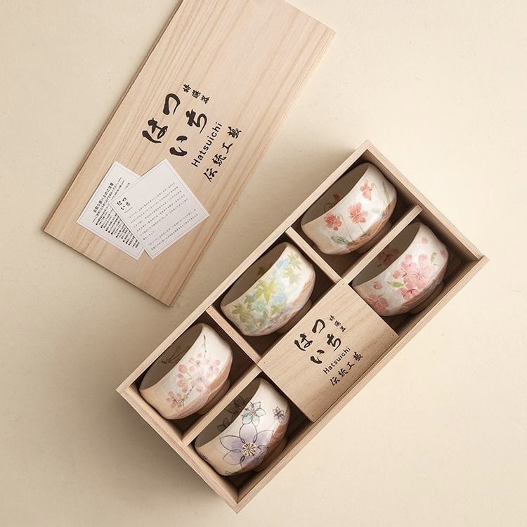 Unique tea cups with nature-inspired designs in a premium wooden gift box.