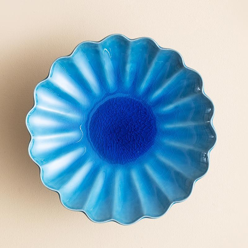 Japanese Mino glazed chrysanthemum-shaped dessert plate with vibrant blue glaze.