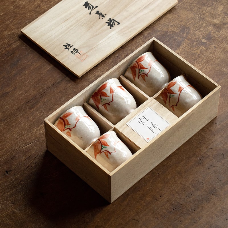 Hand-painted Japanese ceramic cups in an elegant wooden box