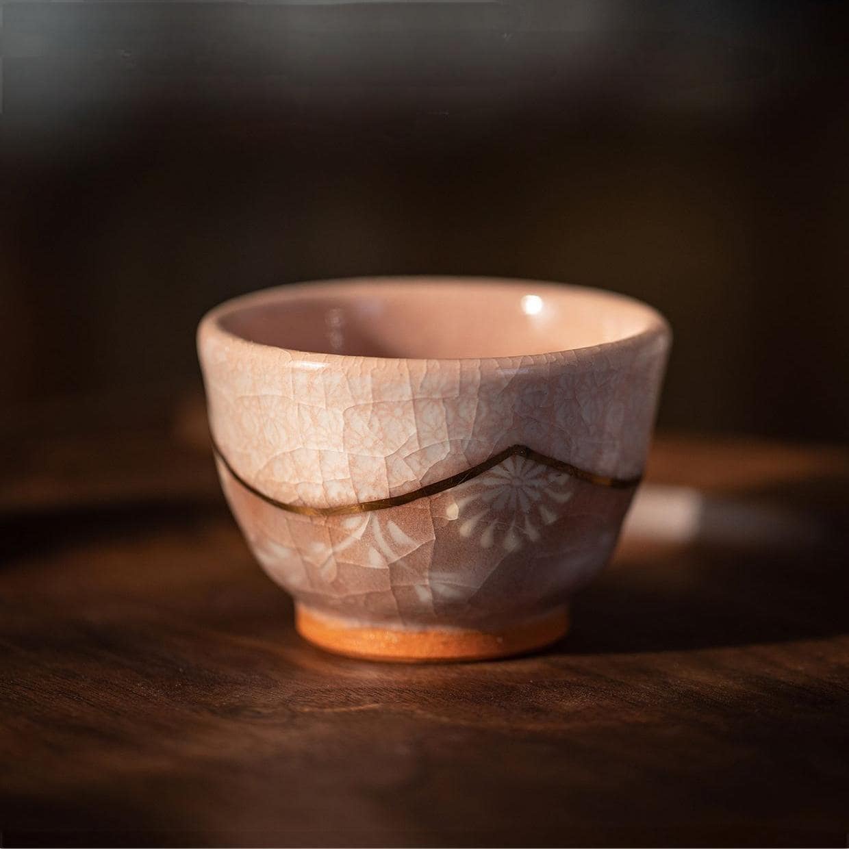 Beautiful retro-styled Japanese teapot and tea cup in natural lighting.