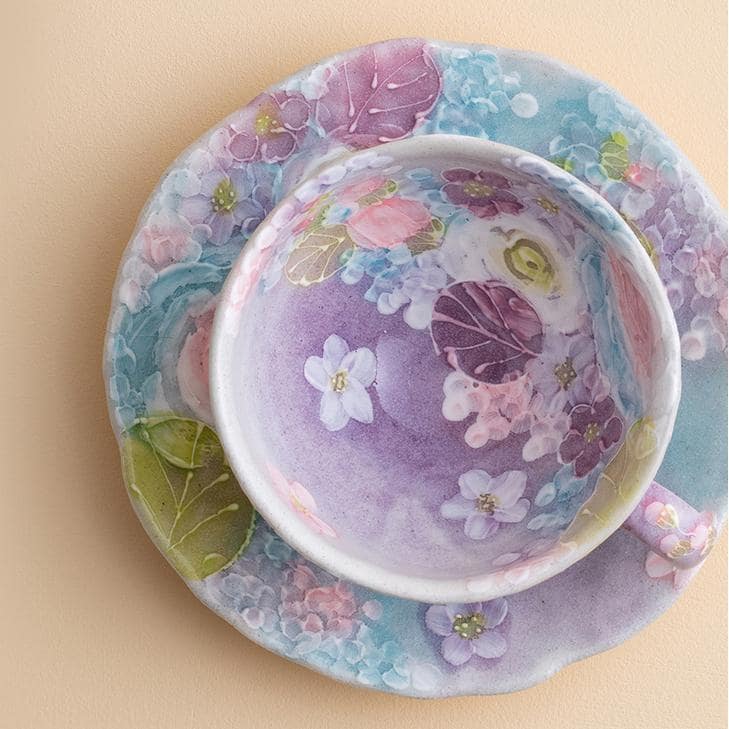 Hand-painted Japanese floral tea cup with saucer in pastel tones