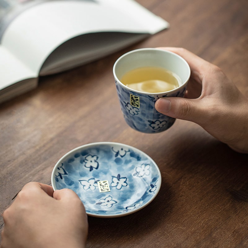 Close-up of blue floral porcelain tea cup and saucer