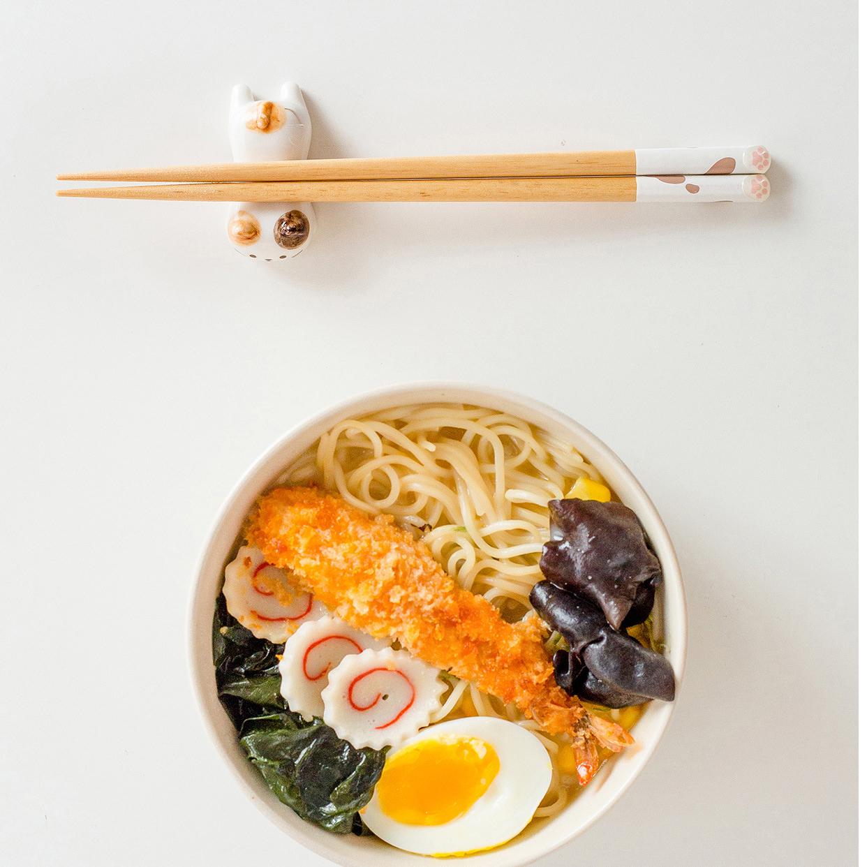 Close-up of cute cat paw-themed reusable chopsticks