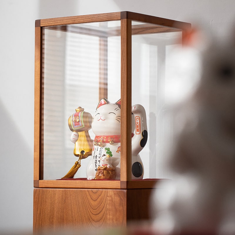 Handcrafted ceramic lucky cats in vibrant traditional designs.