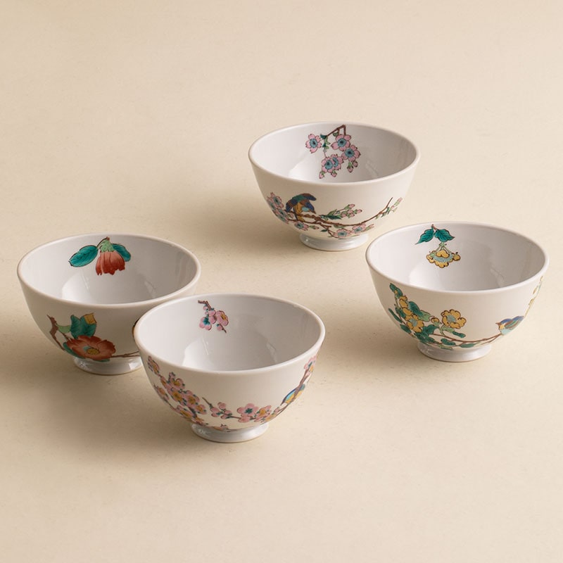 Set of four Japanese ceramic bowls with floral and bird designs