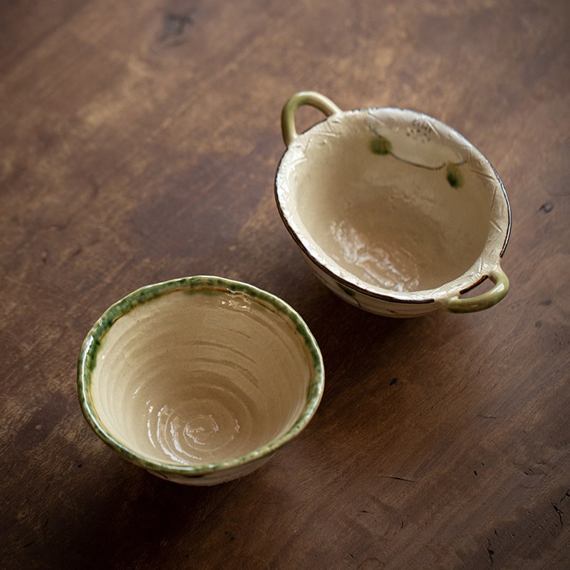 Japanese ceramic double ear bowl with floral design.