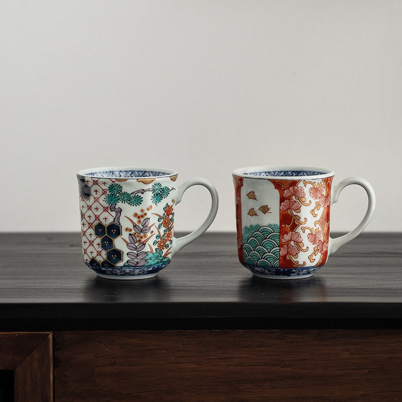 Kutani-style mugs featuring vibrant designs and gold accents