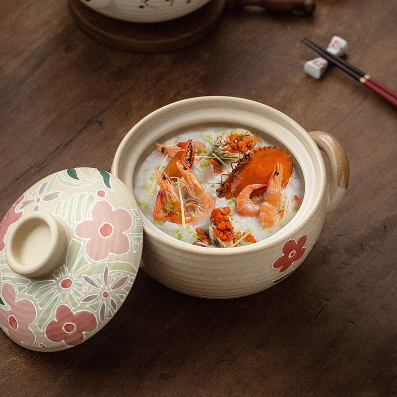 Artisan ceramic casserole dish filled with seafood stew