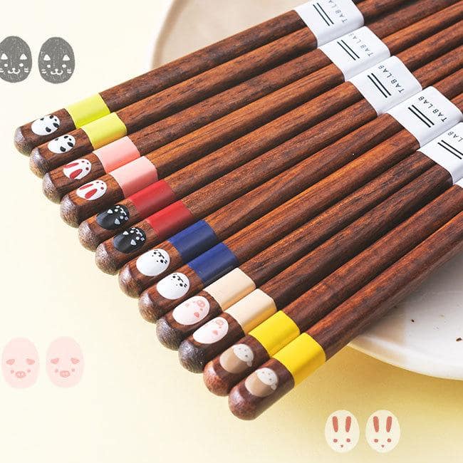 Cute wooden chopsticks with vibrant colors and animal faces