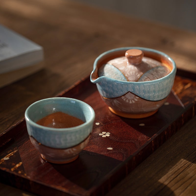 Elegant blue and brown ceramic tea set for luxury tea moments.