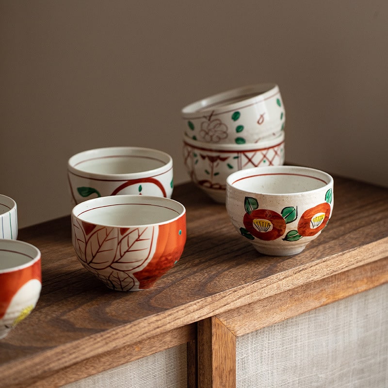 Elegant stack of Japanese-style ceramic bowls on wooden table