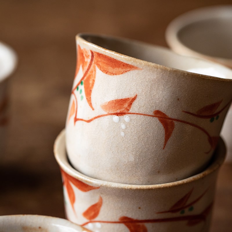 Close-up of hand-painted floral design on ceramic tea cup