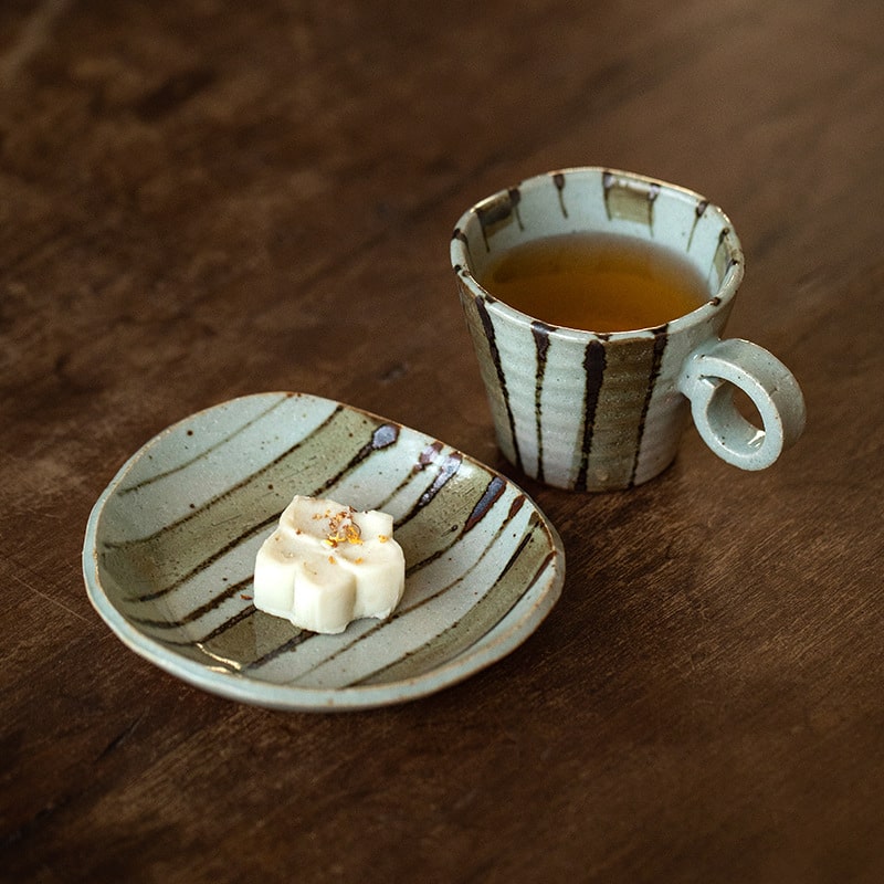 Elegant floral ceramic tea cup with crackle glaze finish.