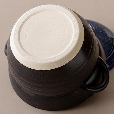 Durable ceramic clay pot base with a smooth finish.