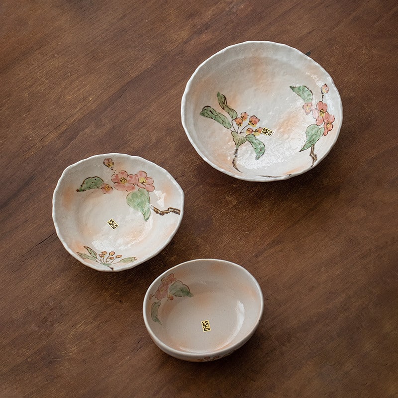 Hand-painted ceramic bowls with delicate floral patterns