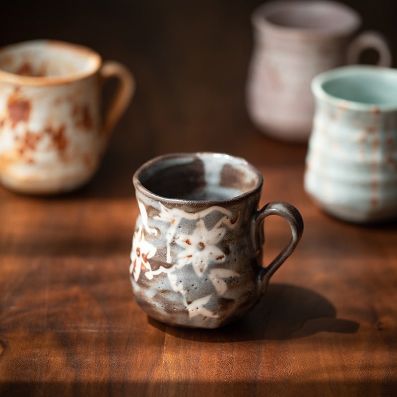 Nature-inspired ceramic cup on a wooden table