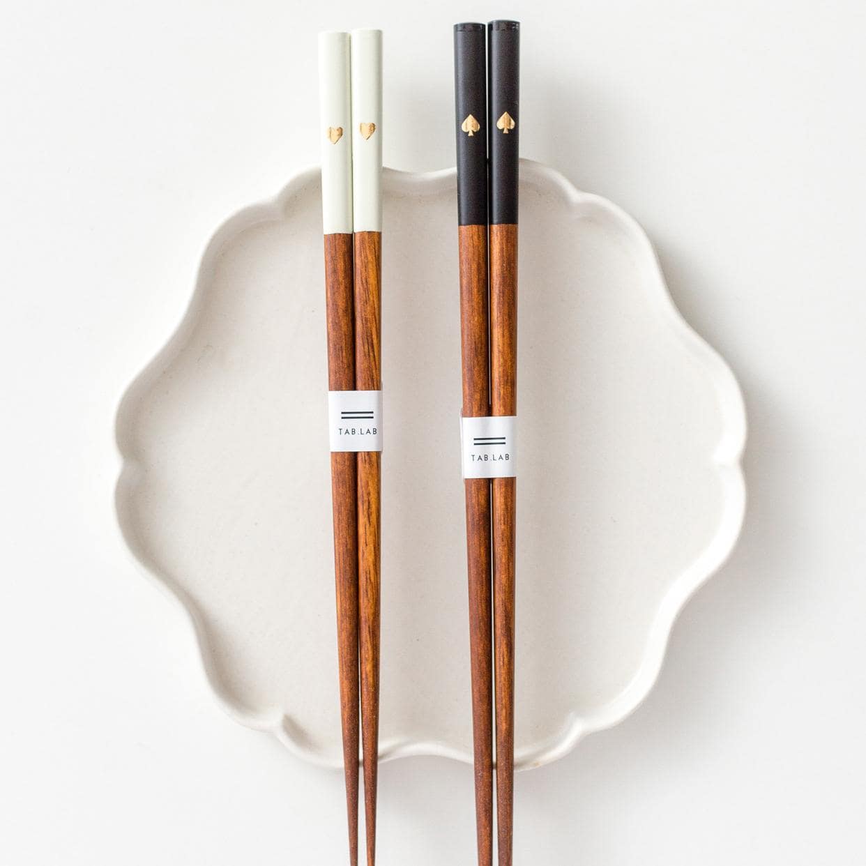 Minimalist black and white chopstick set with gold accents