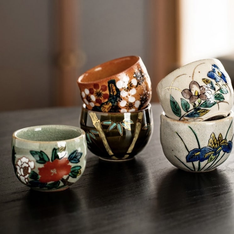 Elegant ceramic sake set featuring floral motifs.