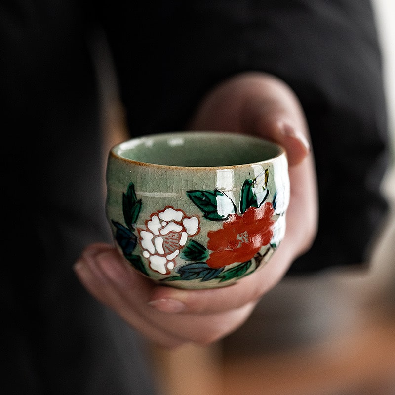 Close-up of ceramic sake drinking set detail.