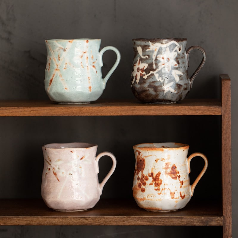 Set of artisan mugs with earthy tones