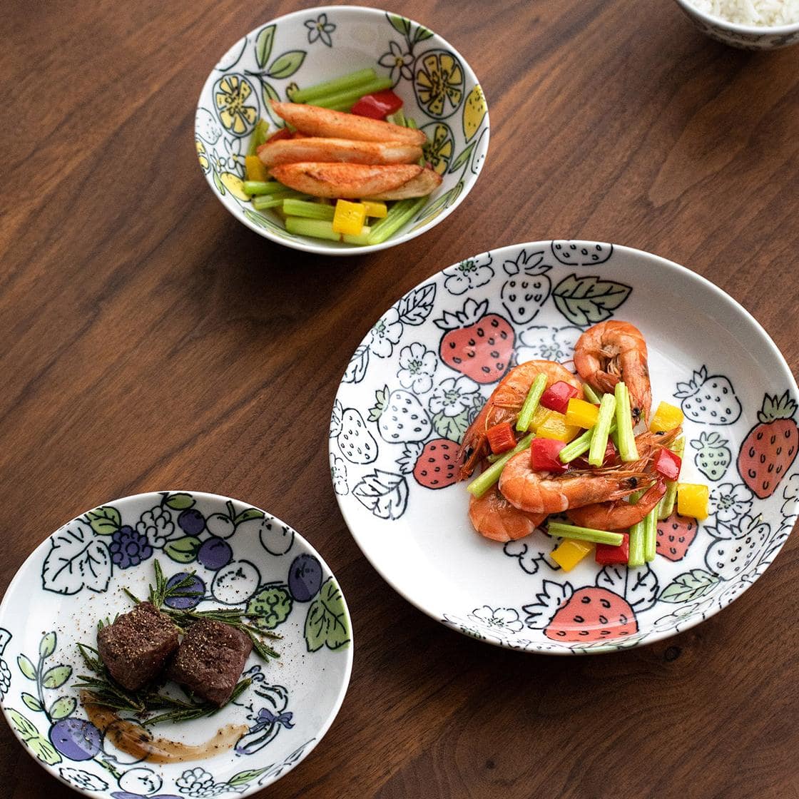 Artistic porcelain bowl set arranged with vibrant patterns