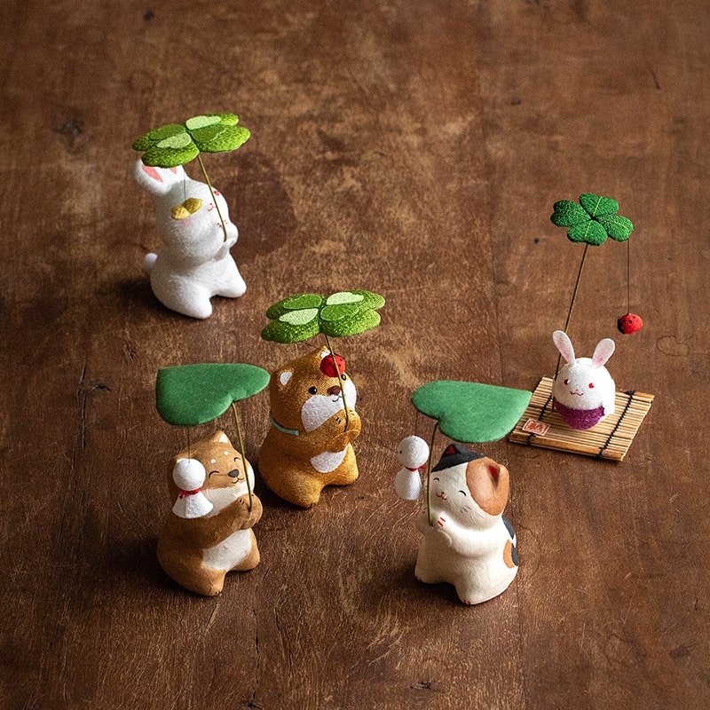 Group of Japanese Walking in the Rain ceramic animal ornaments.