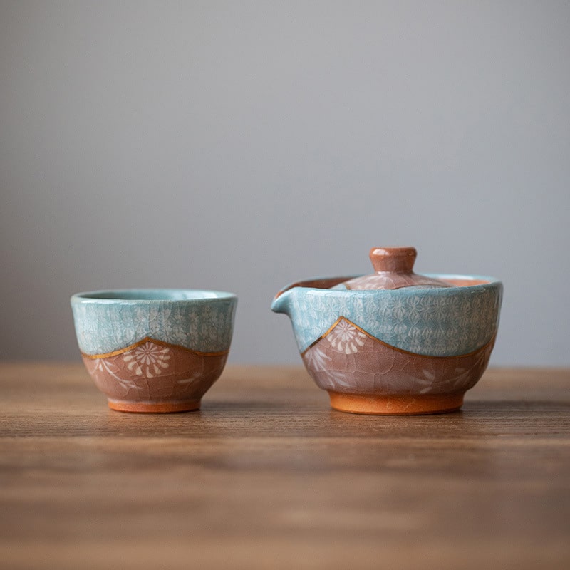 Close-up of a detailed Nishikawa Sadazaburo ceramic fair cup.