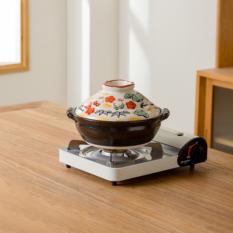 Ceramic hotpot featuring traditional pine, bamboo, and plum designs.