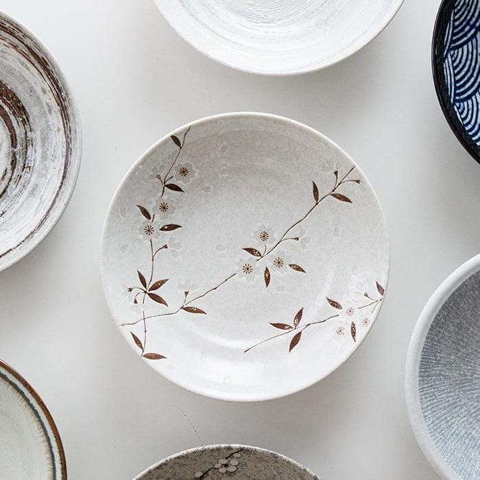 Set of rustic and modern ceramic plates on table