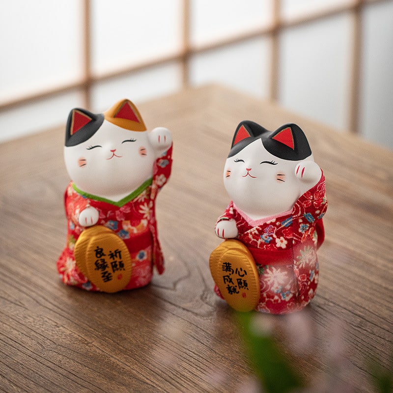 Handcrafted Japanese lucky cat with kimono details for home decor.