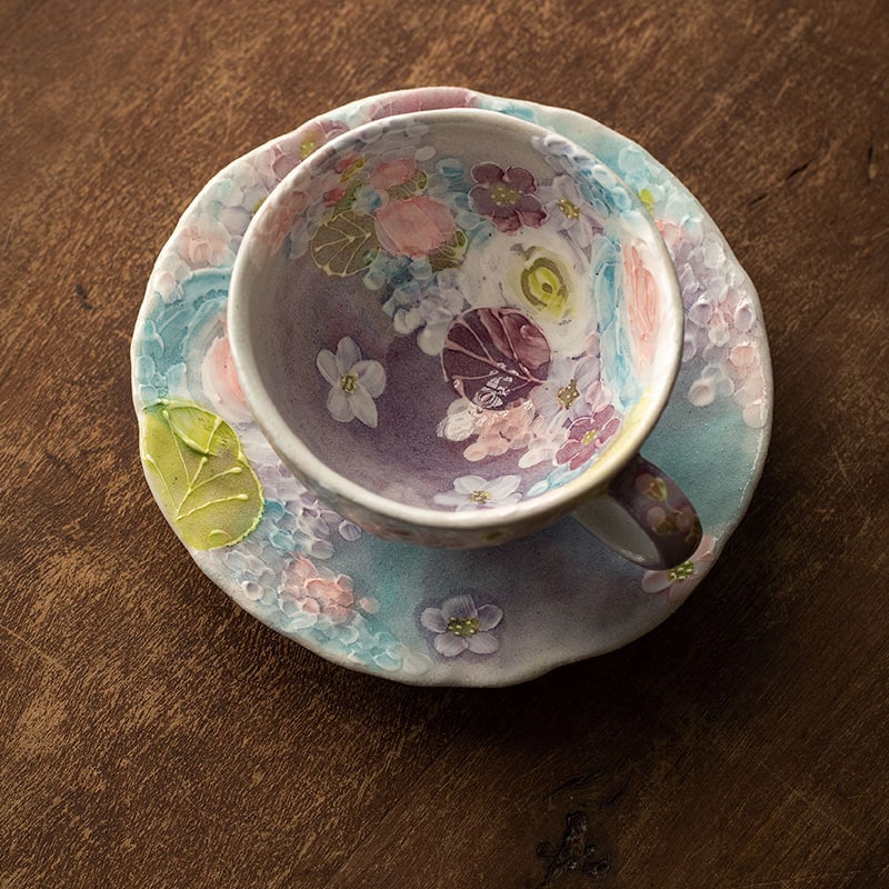 Artistic Japanese pottery coffee cup with hand-painted details