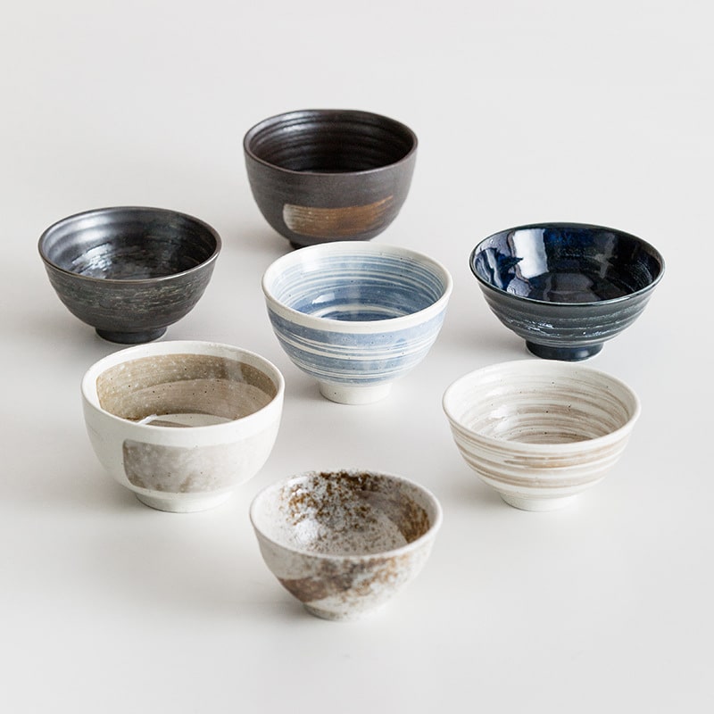 Handcrafted Japanese ceramic bowls in elegant blue and neutral tones