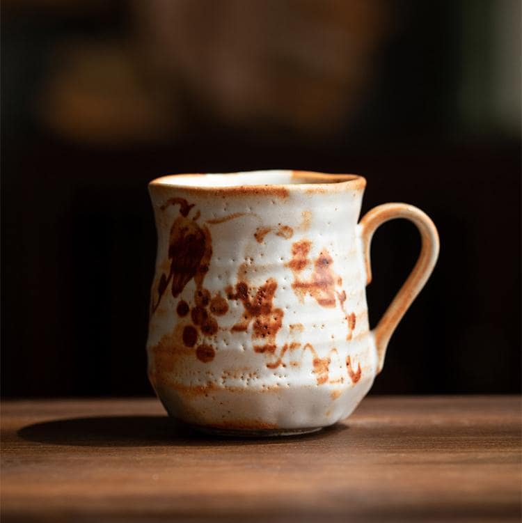 Rustic handcrafted ceramic mug with unique patterns