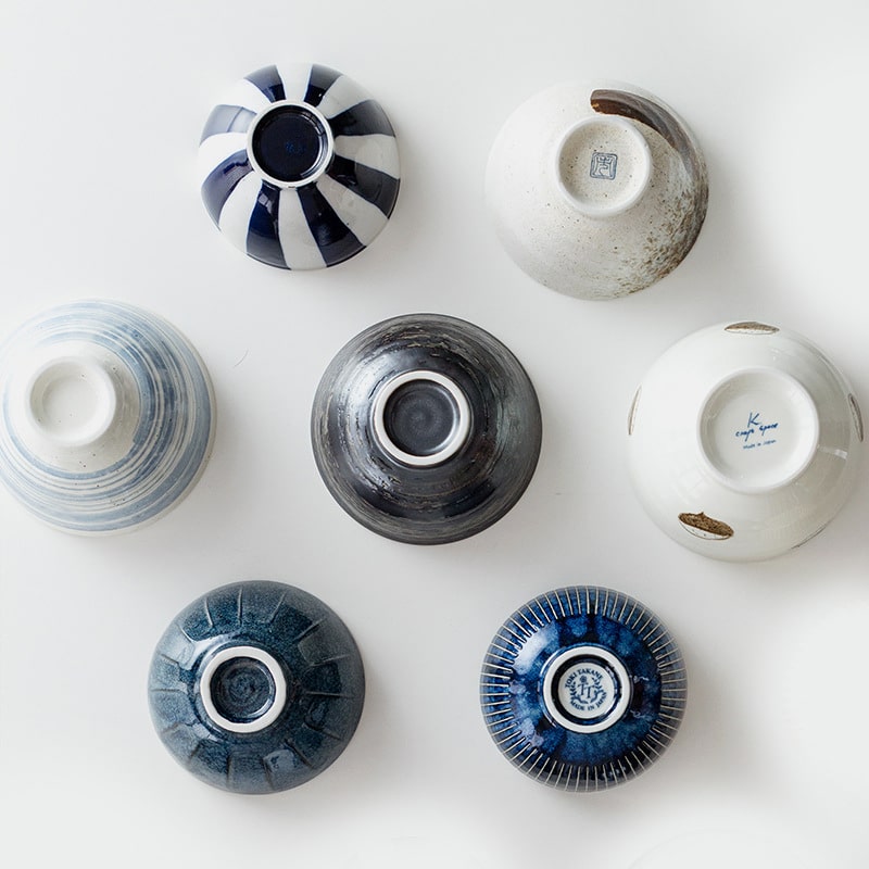 Top view of Japanese ceramic bowl collection with unique patterns