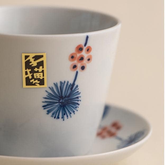 Luxurious hand-painted porcelain tea cup with saucer