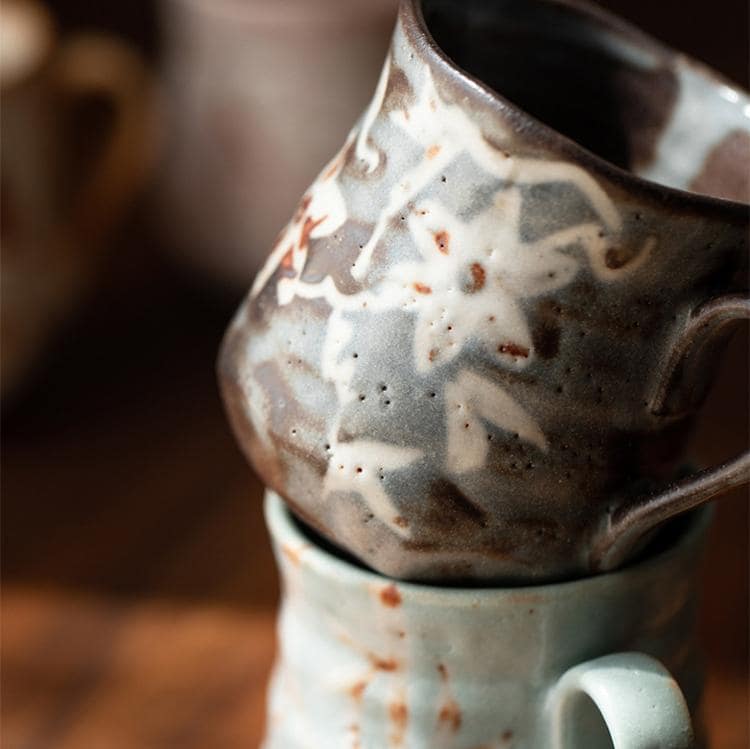 Nature-inspired ceramic cup on a wooden table