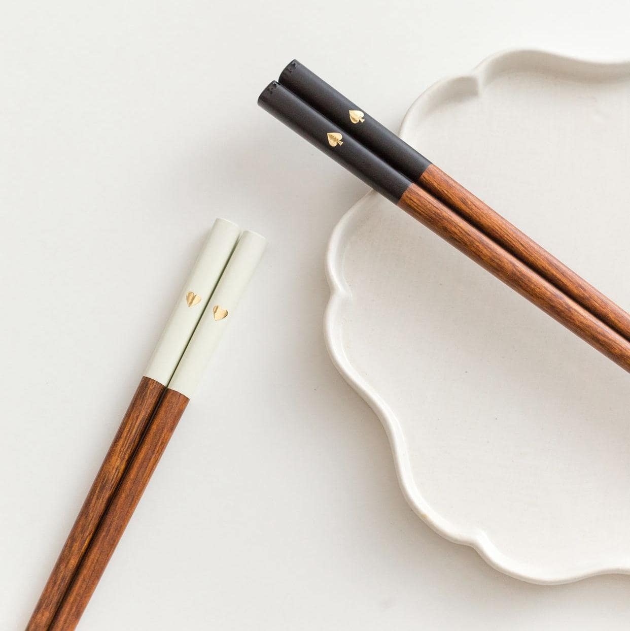 Minimalist black and white chopstick set with gold accents