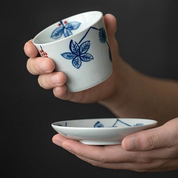 Close-up of blue floral porcelain tea cup and saucer