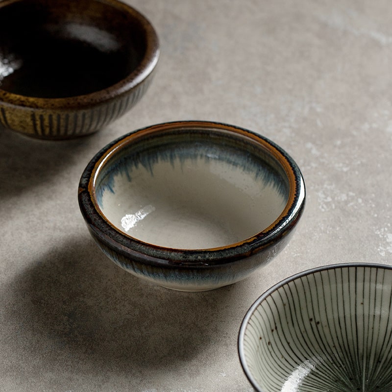 Artisan-crafted deep bowl in neutral hues