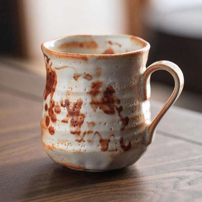 Set of artisan mugs with earthy tones