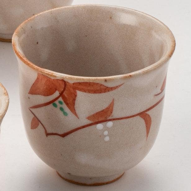 Set of five Japanese ceramic cups with hand-painted patterns