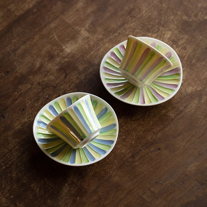 Elegant ceramic tea cups on a wooden table