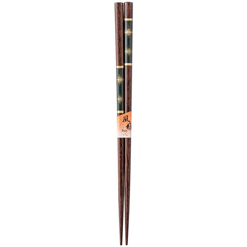 Decorative red and green chopsticks with golden accents