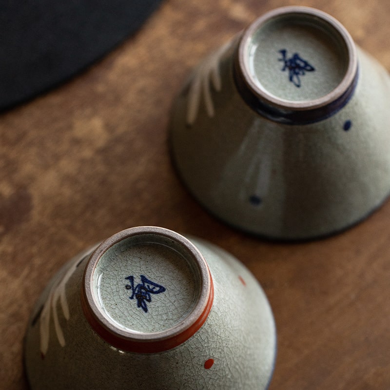 Rustic ceramic bowls stacked on wooden surface