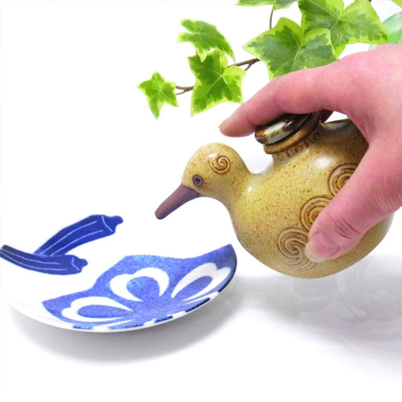 Whimsical ceramic bird oil pot used for soy sauce and oils.