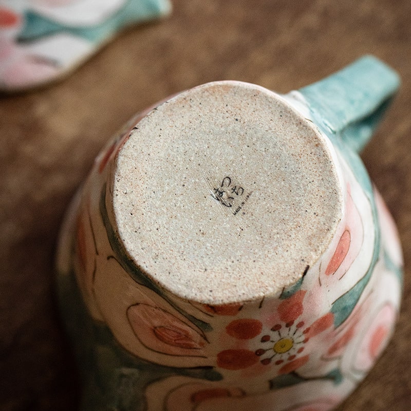 Close-up of teapot bottom with artisan mark