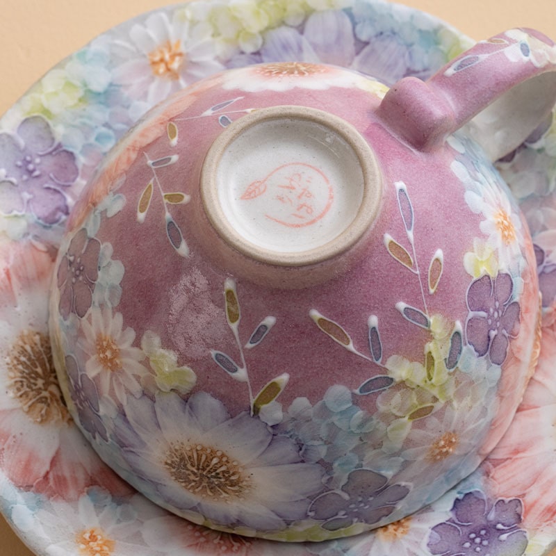 Delicate Japanese tea cup featuring a unique floral design