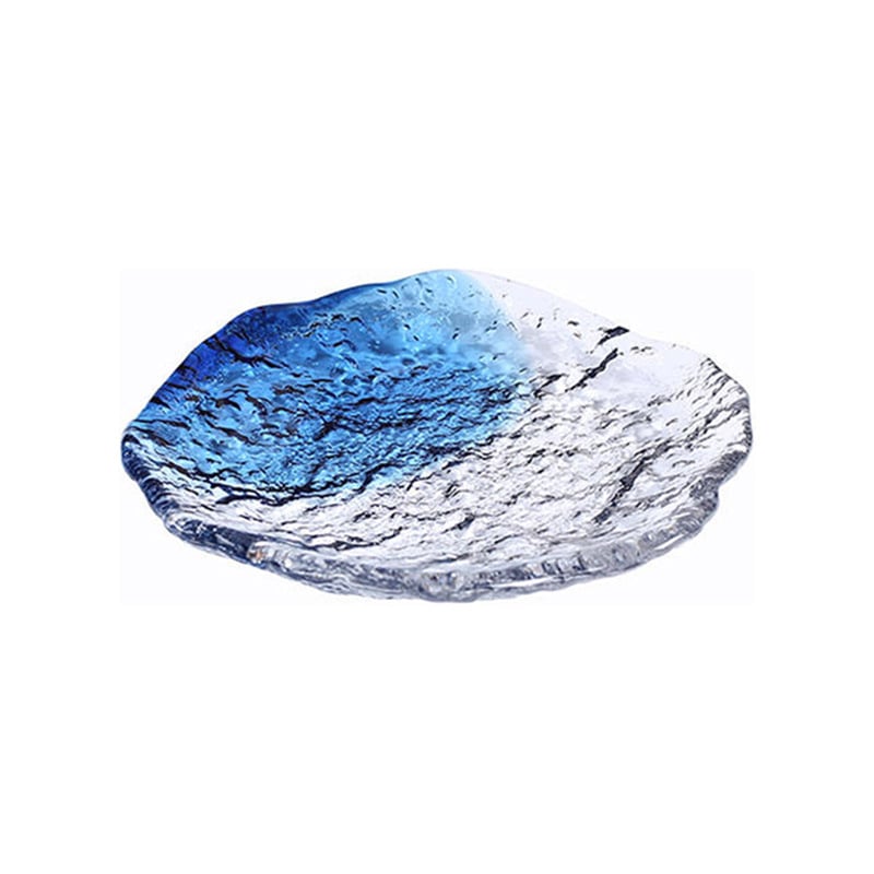 Artisan glass fruit plate with textured, irregular edges.