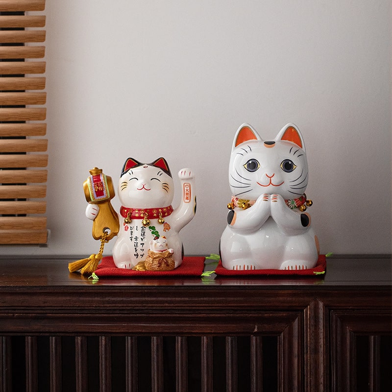 Set of Japanese-style ceramic lucky cats for home decor.